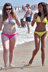 Two curly bikini chicks showing themselves